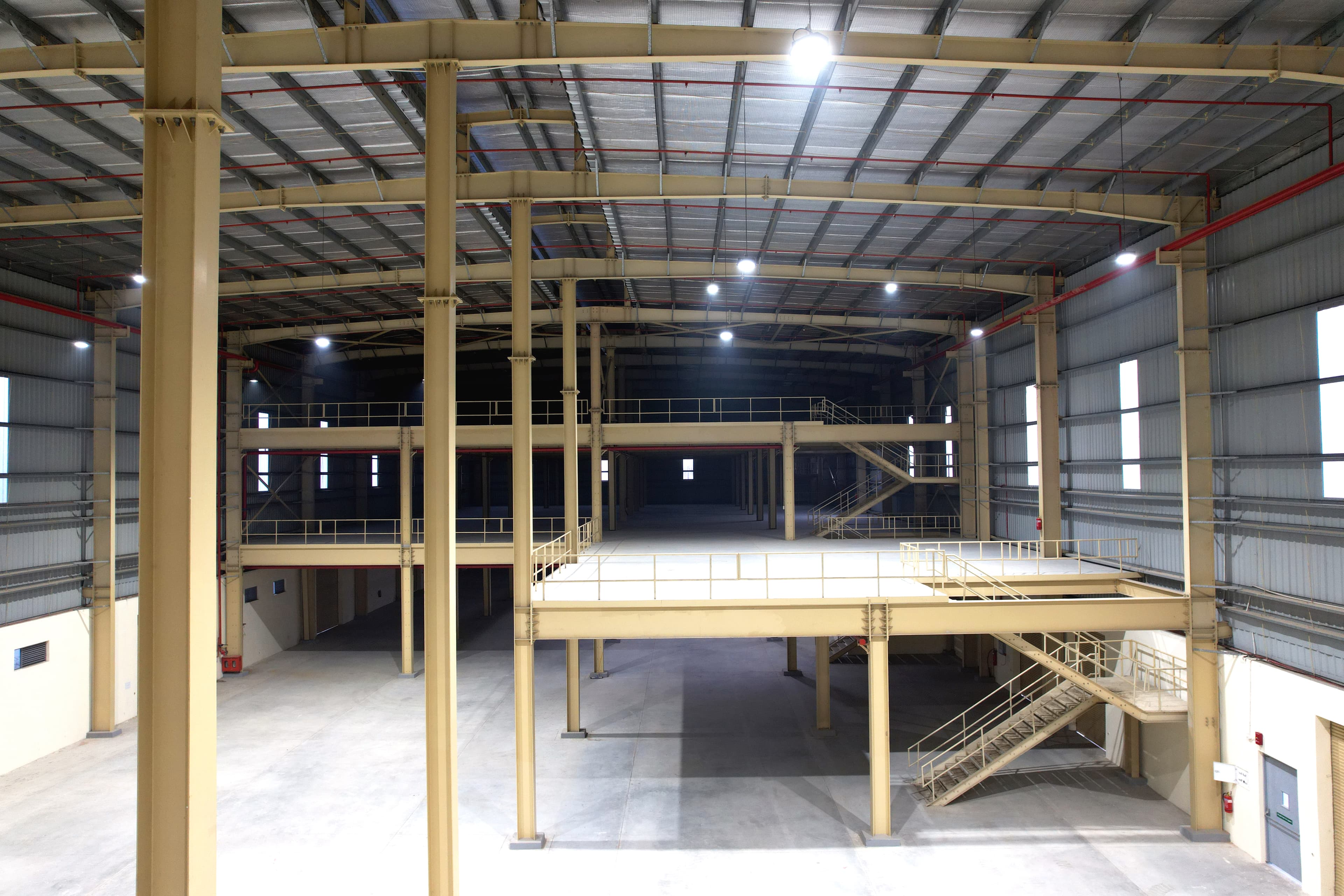 Structural steel mezzanine with columns, beams and intermediate floor system