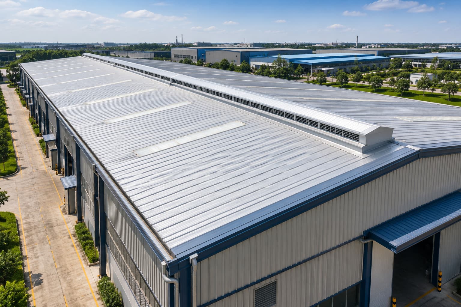Continuous ridge ventilator installed on a modern industrial Pre-Engineered Building