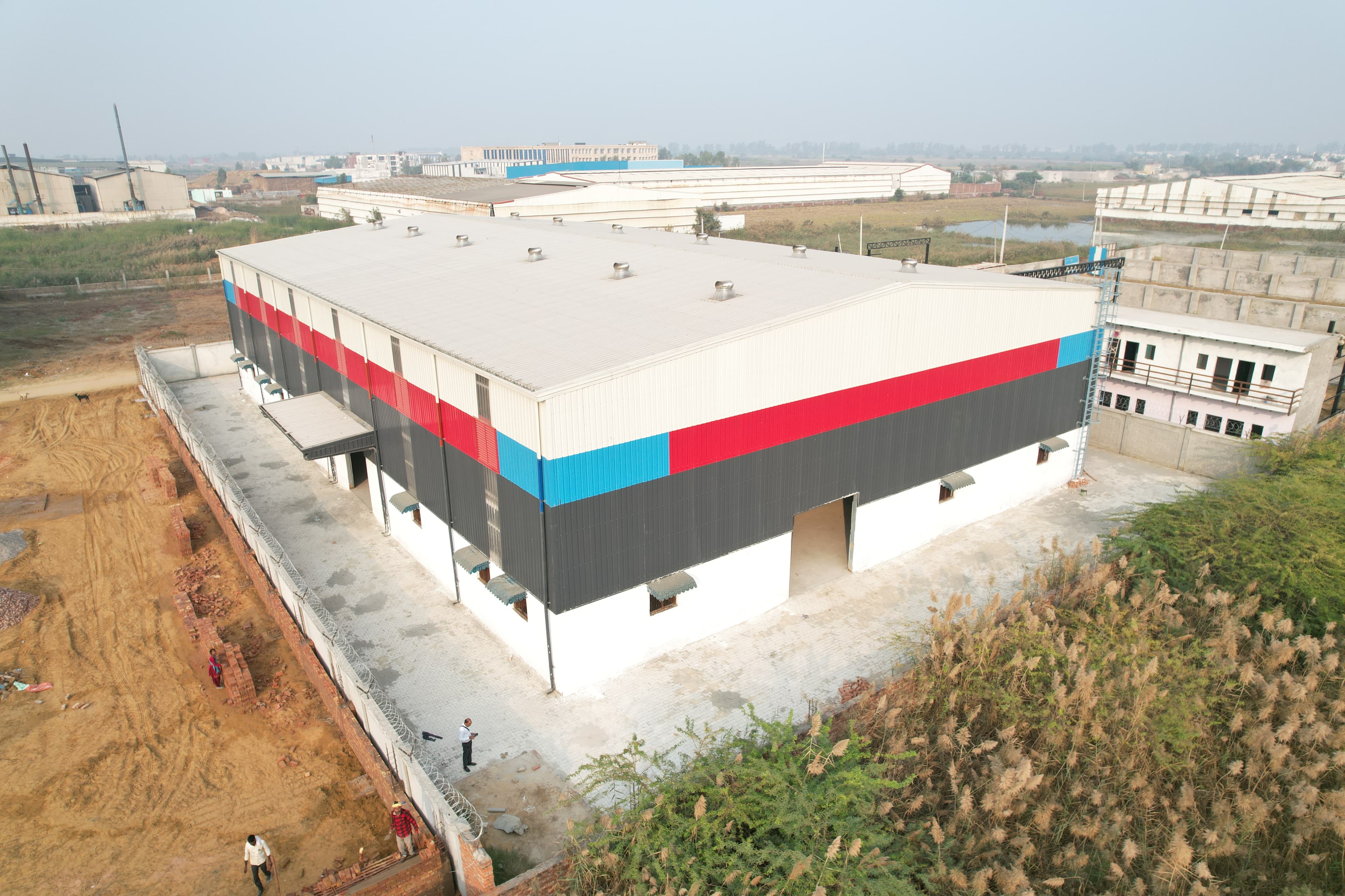Automobile Pre-Engineered Building solution by Steelbuild Infra Projects