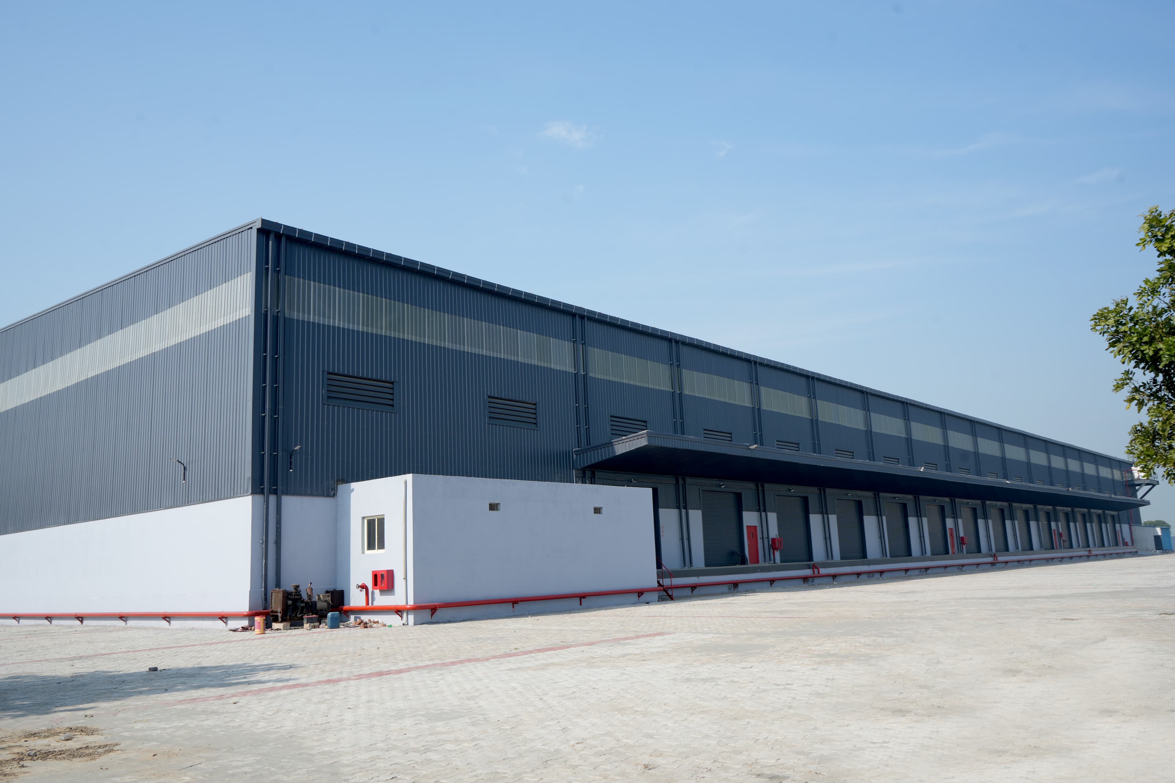 Industrial steel shed designed for manufacturing and operational use